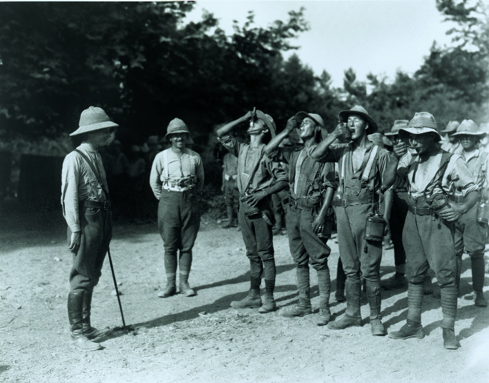 British troops taking their daily dose of quinine, July 1917. (Imperial War Museum)