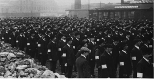 Ranks of factory workers (probably at the Sirrocco Works, Belfast) with UVF armbands. (PRONI)